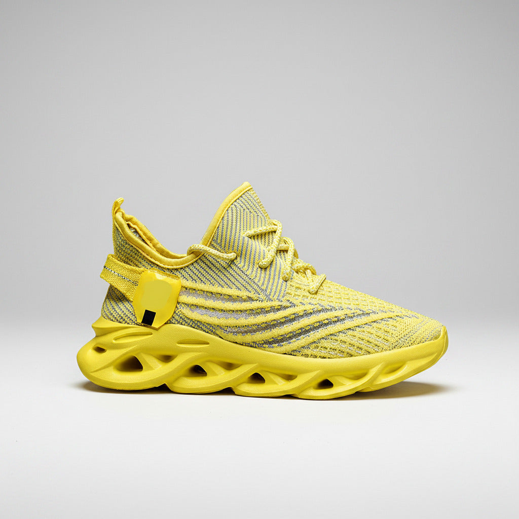Yellow sneaker with unique sole design on a white background