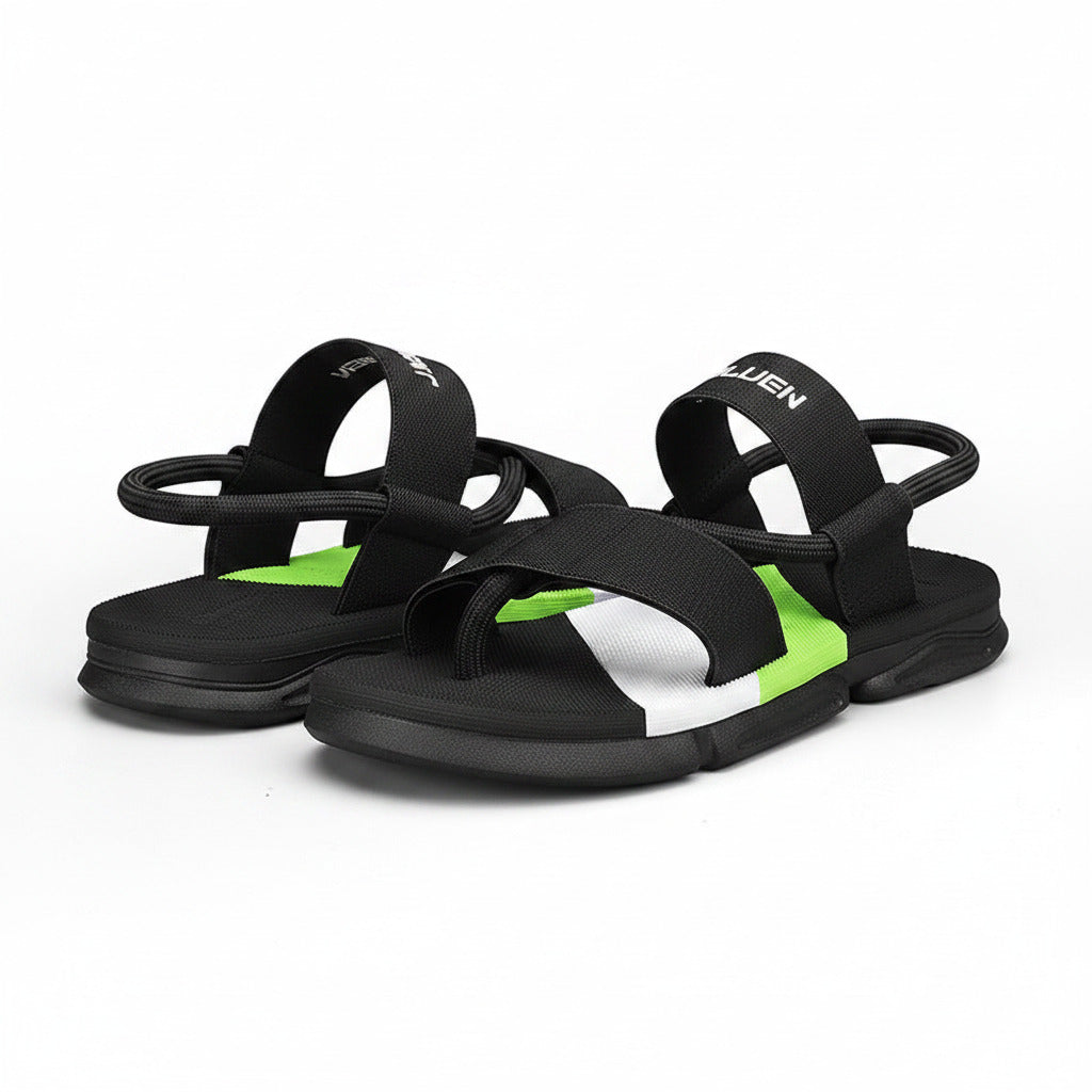 Black sandal with green interior on a white background