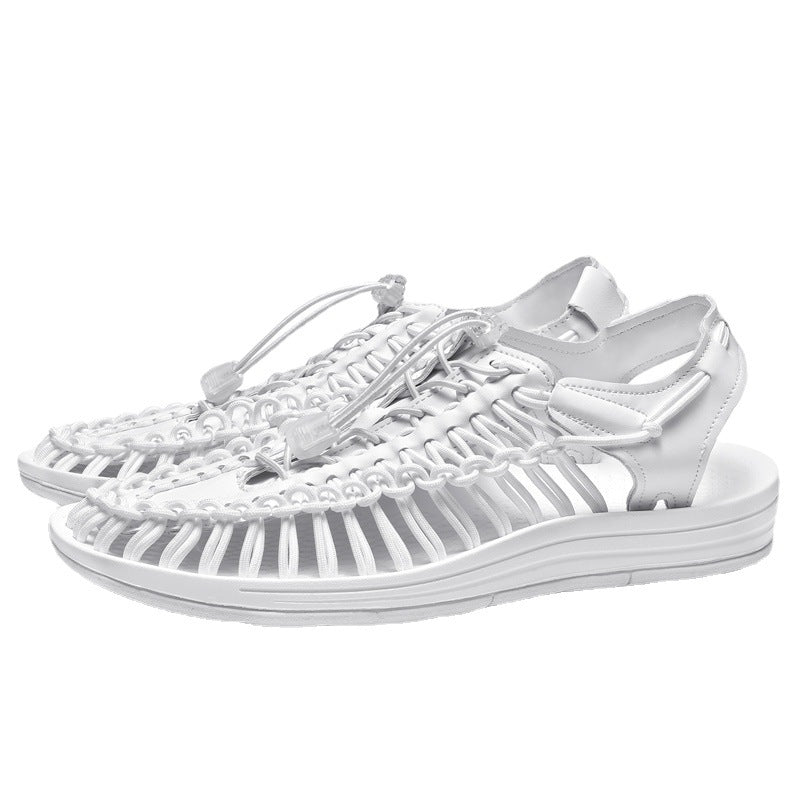White sandals with a unique design on a white background