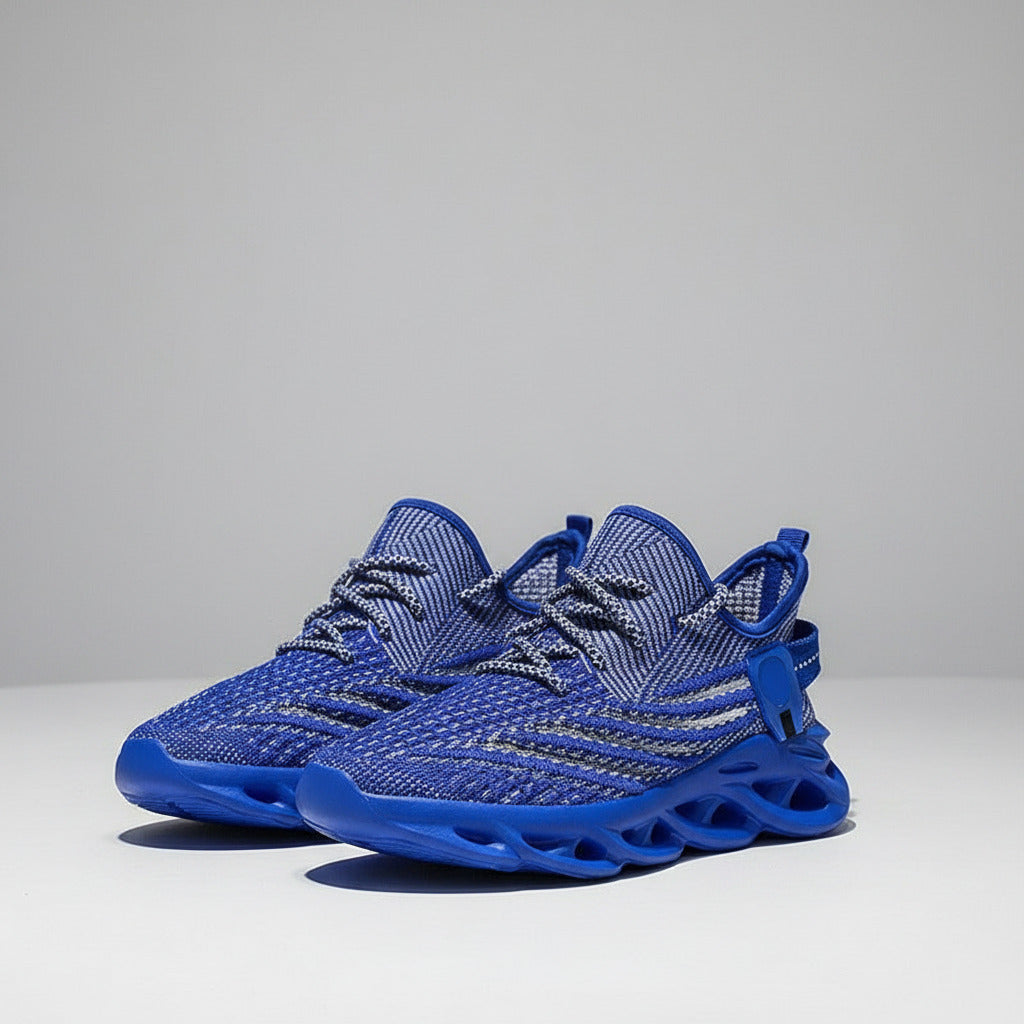 Blue athletic shoes with unique sole design on a reflective surface.