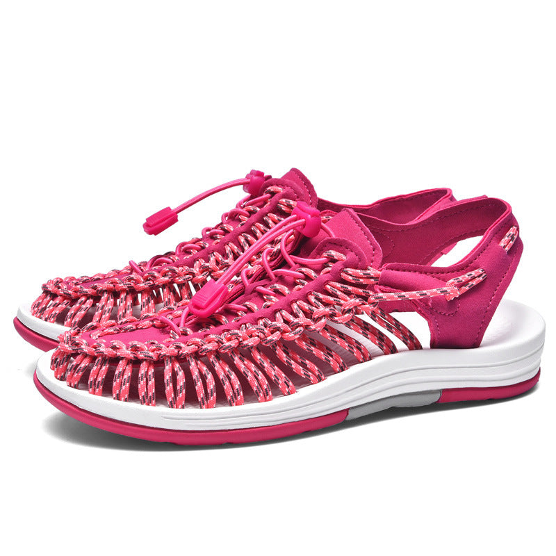 Pink sandals with white sole on a white background