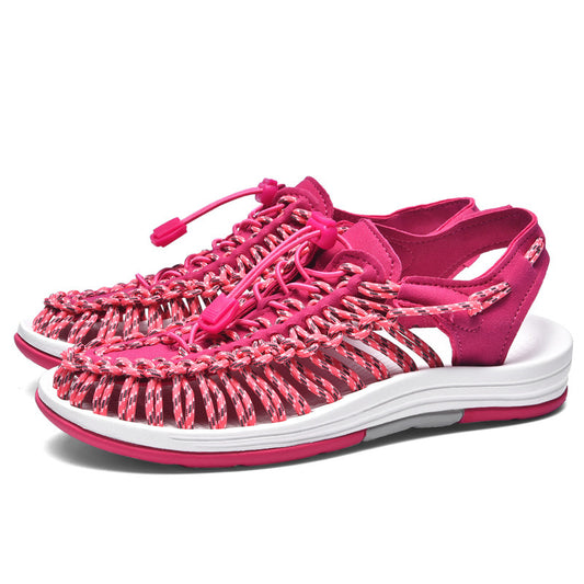 Pink sandals with white sole on a white background