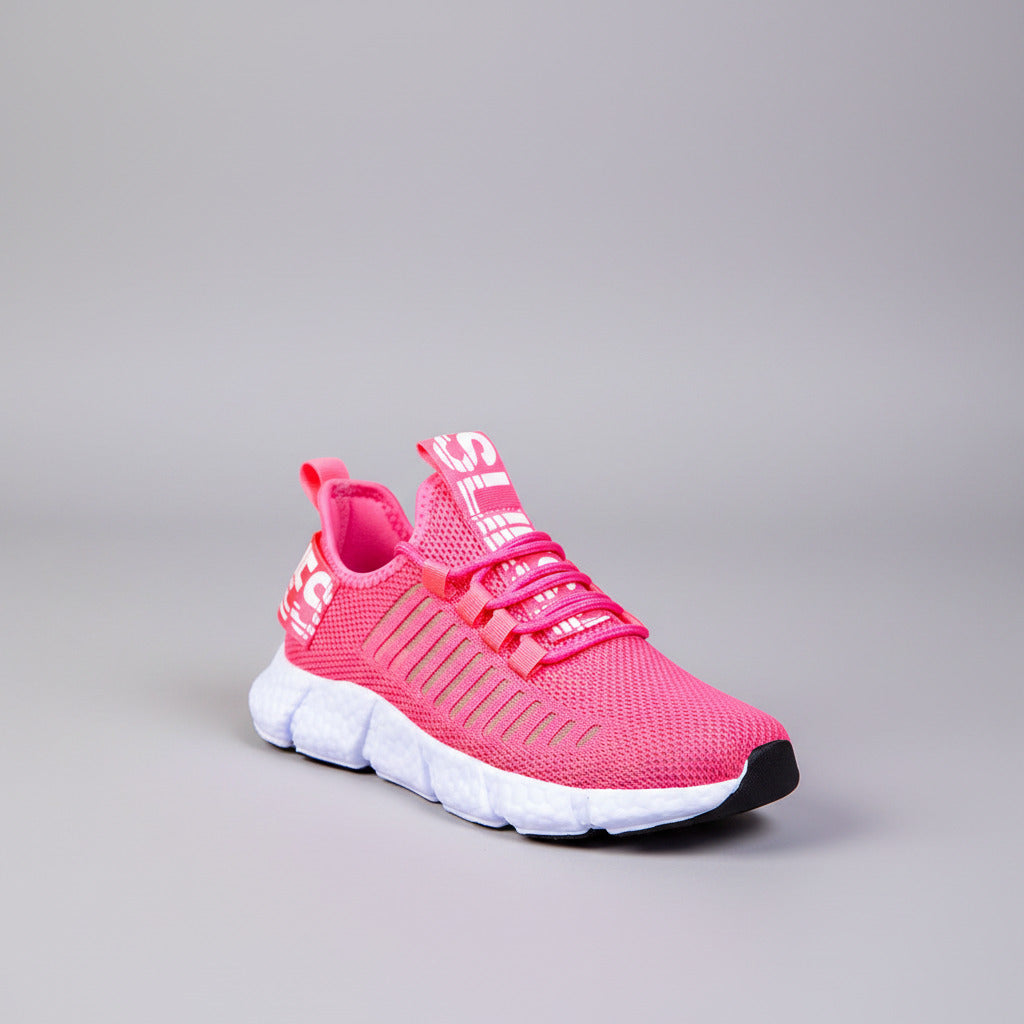 Pink running shoes on a wooden floor