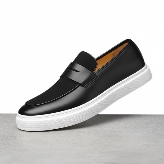 Black loafer shoe with white sole on a white background