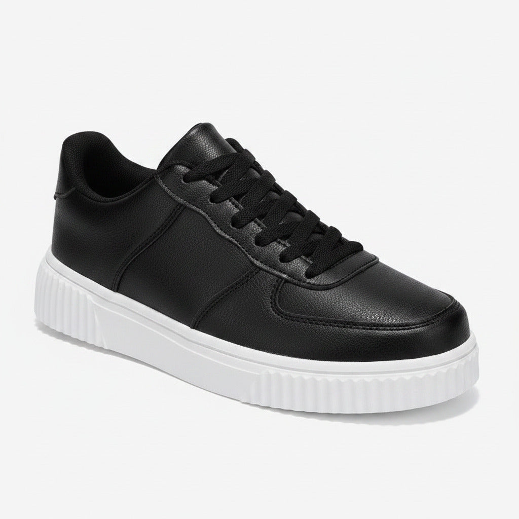 Black sneaker with white sole on a white background