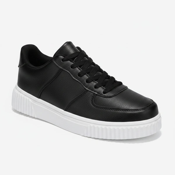 Black sneaker with white sole on a white background