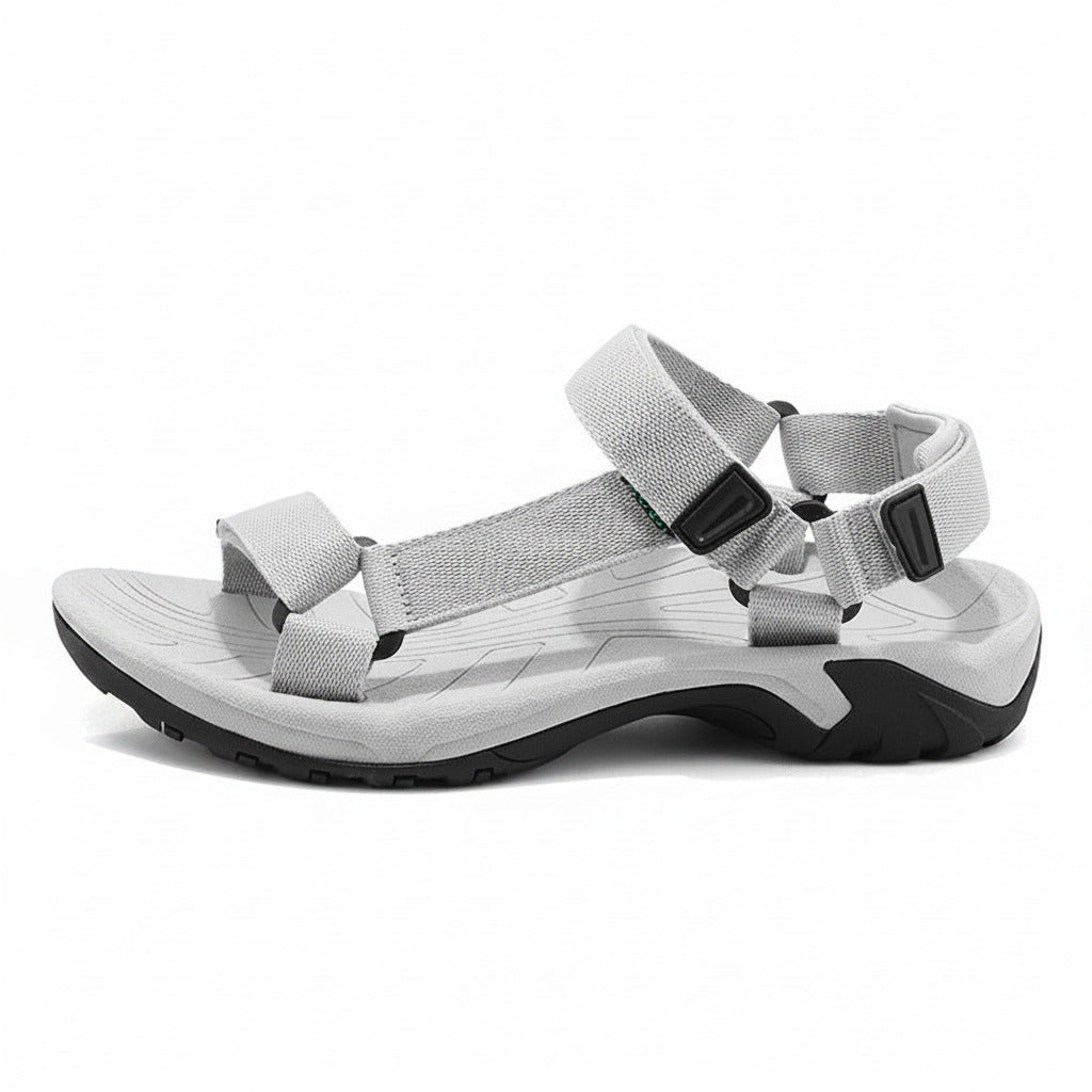 Gray sandal with multiple straps on a white background