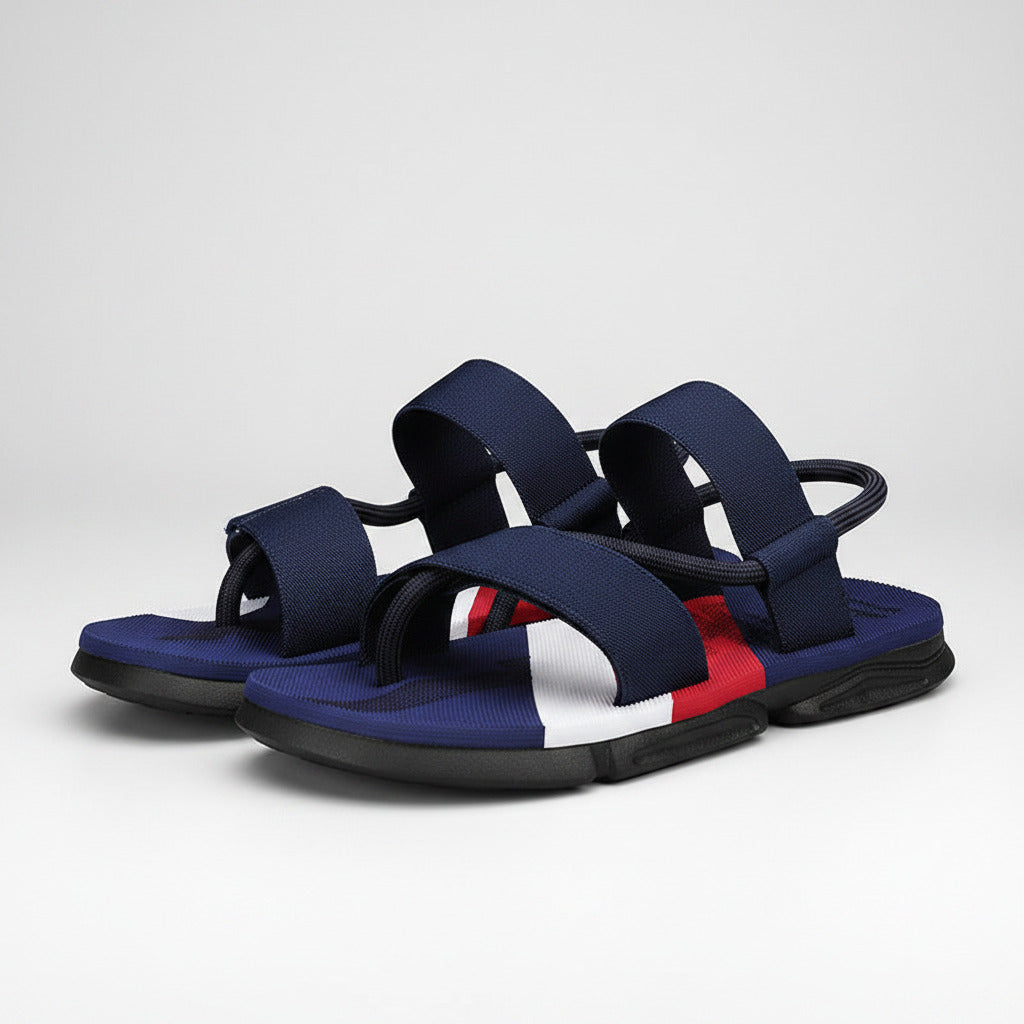 Blue sandal with red and white sole on a white background