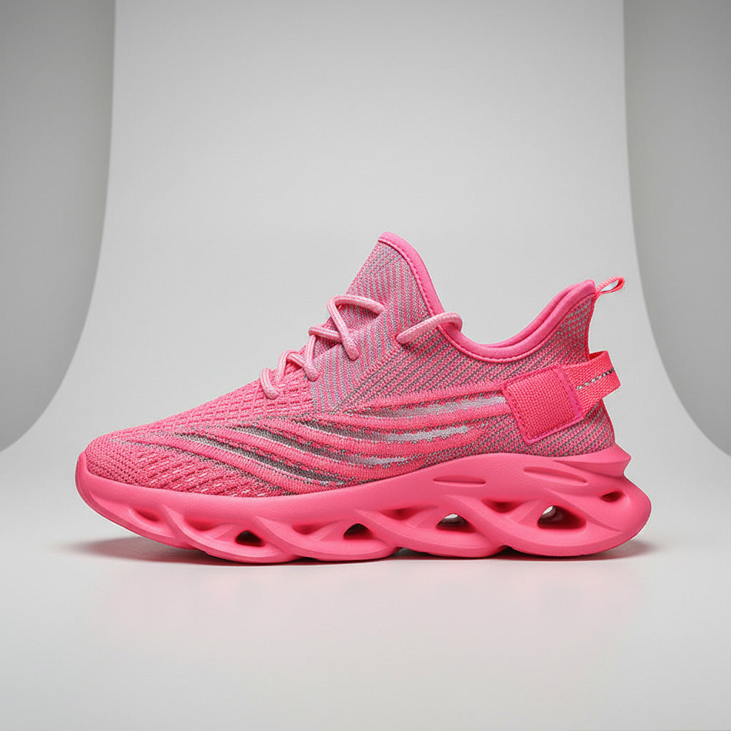Pink athletic shoe with unique sole design on a white background