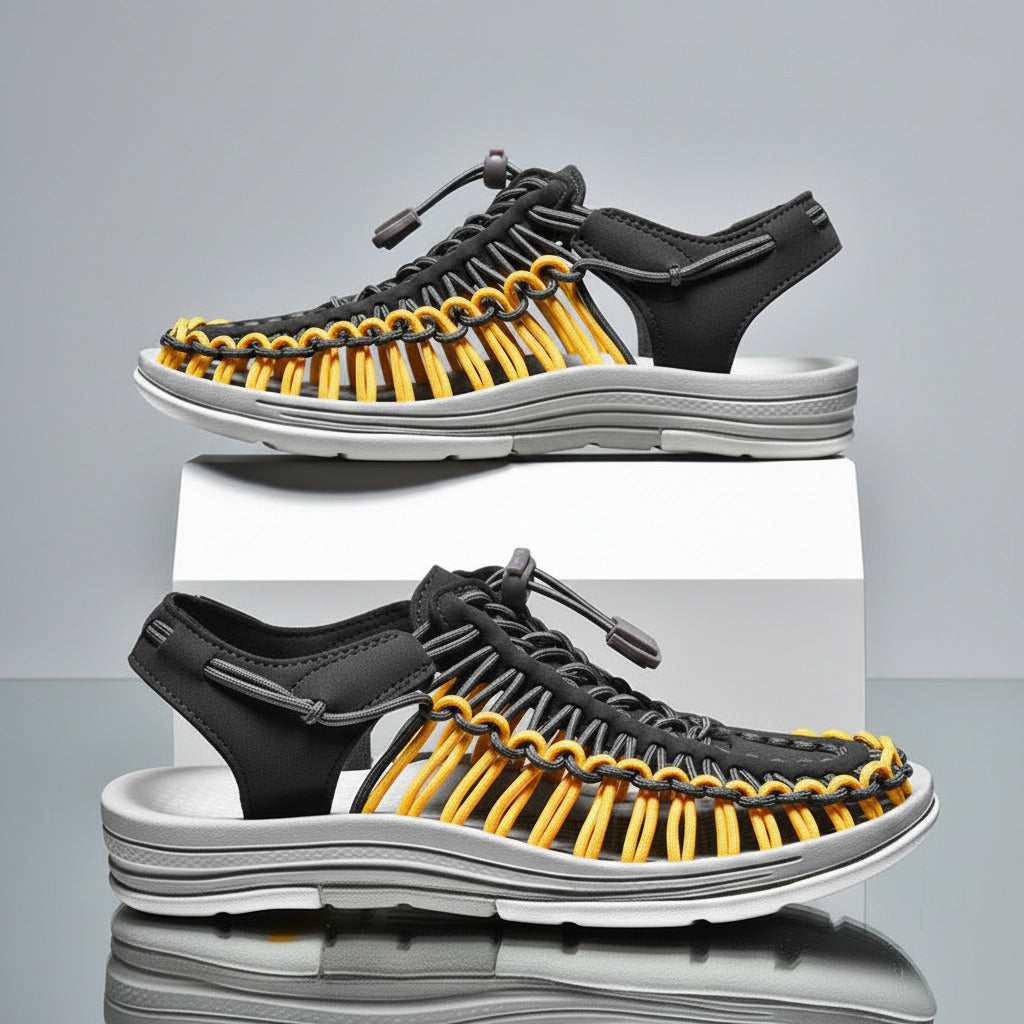 Black and yellow sandals with a light blue background