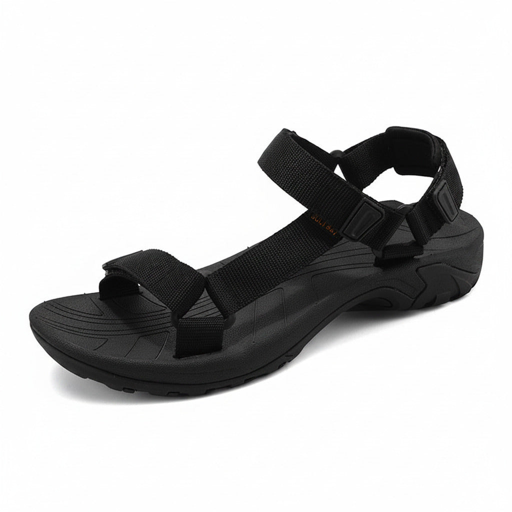 Black sandal with multiple straps on a white background