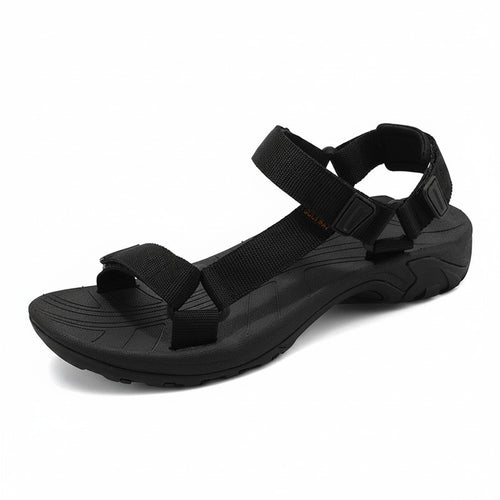 Black sandal with multiple straps on a white background