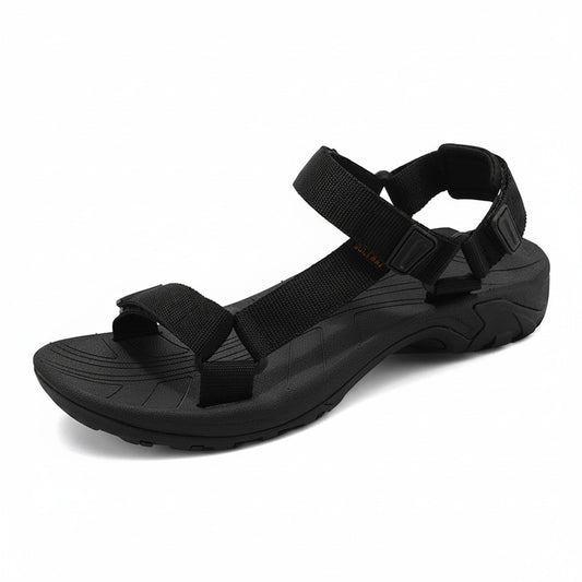 Black sandal with multiple straps on a white background