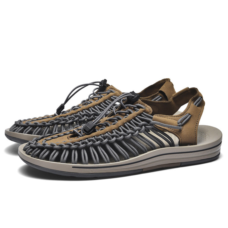 Pair of brown and gray sandals on a white background