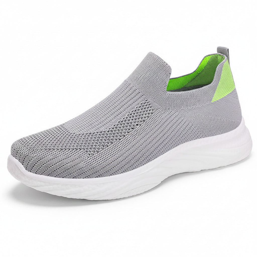 Gray slip-on sneaker with a white sole on a white background