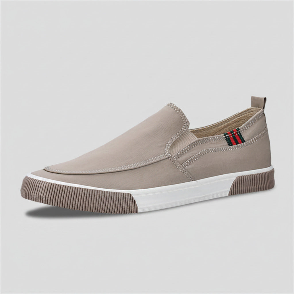 Beige slip-on sneaker with a white sole on a white background